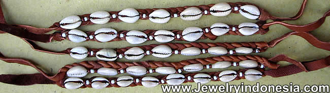 Leather bracelets with cowry shells